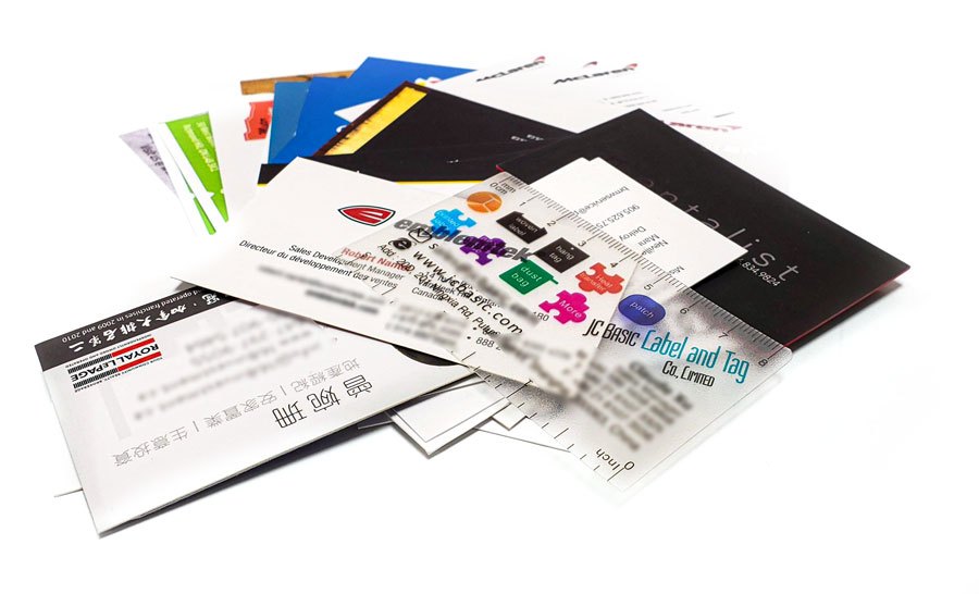 Assorted business cards showcasing vibrant designs and branding, highlighting C17media's digital and offset printing services for effective marketing and networking.