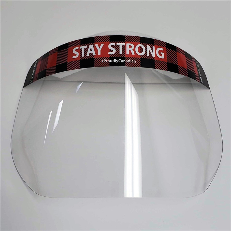 Face shield featuring "STAY STRONG" slogan and #ProudlyCanadian, symbolizing community support during COVID-19.