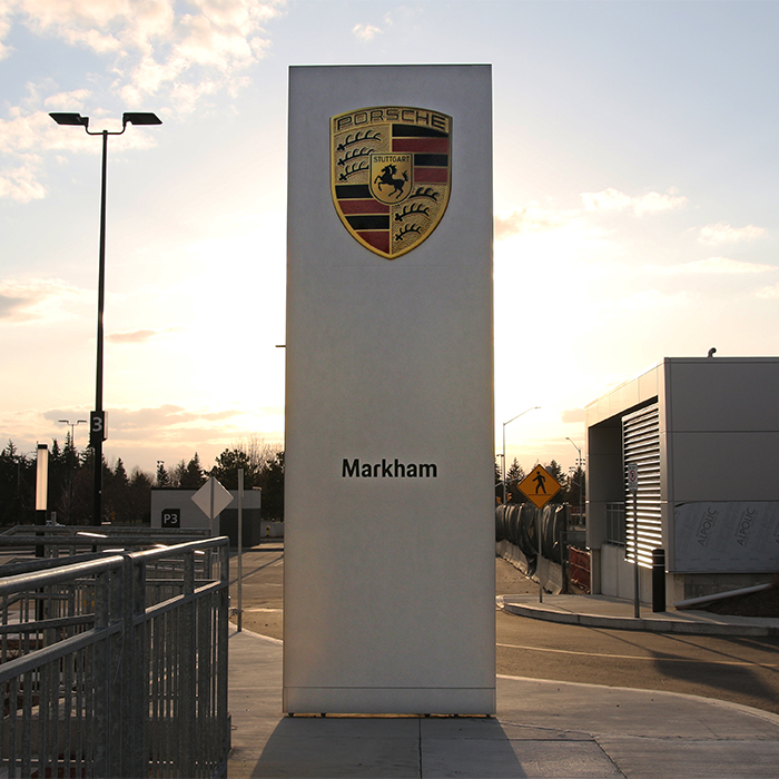Porsche Centre Markham sign featuring the Porsche logo and brand name, highlighting a new dealership visual branding project by C17media.